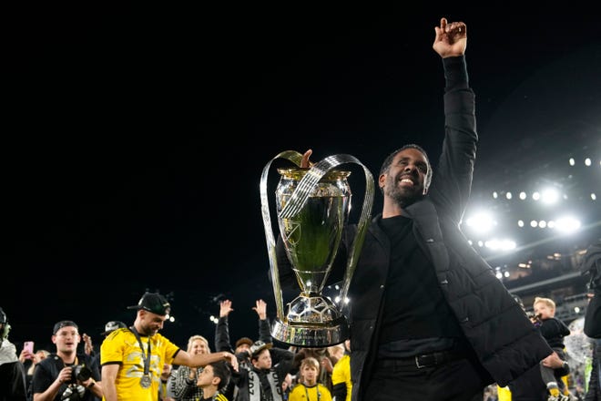 Columbus Crew head coach Wilfried Nancy hoists the Philip J. Anschutz Trophy after defeating the Los Angeles FC in the 2023 MLS Cup championship game at Lower.com Field on Dec. 9, 2023.