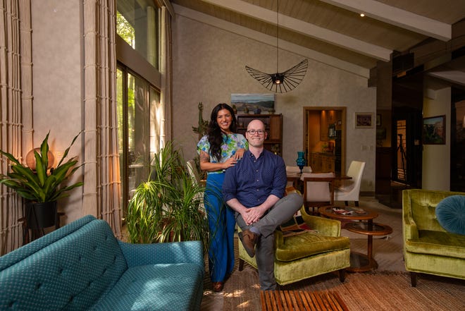 Heather McCloud with her husband, Nathan Parry, in their Worthington home, dubbed “the Brass House” after McCloud’s Clintonville shop, the Brass Hand (Photo by Tim Johnson)